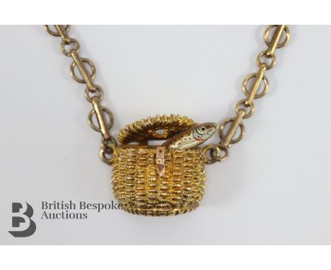 9ct gold and enamel fishing creel tie slide, depicted with a salmon leaping out of the basket, approx 9.2 gms.&nbsp;