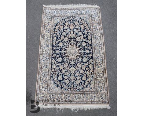 Persian Nain fine wool and silk carpet, black, blue and grey foliate design on cream ground, tassels and selvedges complete, 