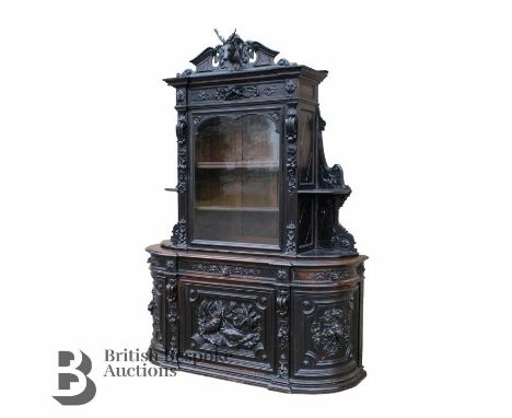 19th century Black Forest hunting lodge credenza. This impressive cabinet is divided in two-parts. The rounded intricately ca