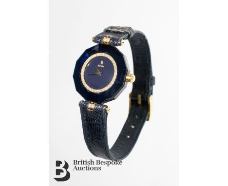 H. Stern lady's 18ct gold and diamond-set wrist watch. The wrist watch having a black face with diamond set chapter ring, 24 