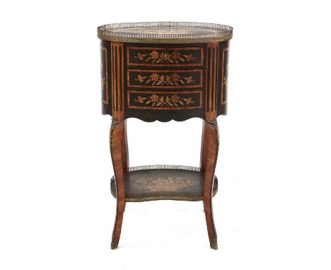 A French kingwood, inlaid and ebonised oval commode , 19th century, with floral decoration, the brass galleried top above thr