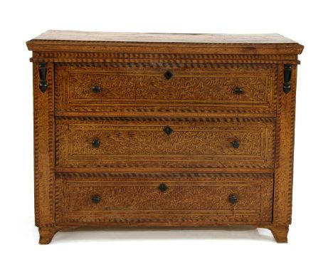 A Northern European scumbled pine commode chest, late 19th century, having three long drawers with ebonised turned handles, o