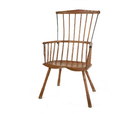 A Windsor armchair, 18th century, with a stick and comb back, old metal repairs , 73cm wide 56cm deep 116cm high