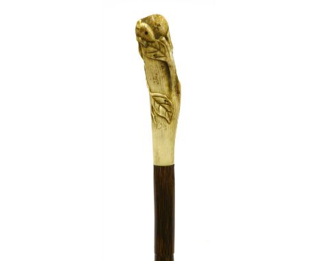 A Japanese antler/bone and partridgewood walking stick , Meiji period, the carved handle in the form of a rat among leaves, o