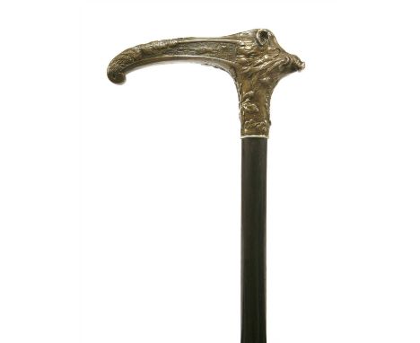 A silver and ebonised wood walking stick, late 19th century, the handle in the form of a boar's head, decorated with oak leav