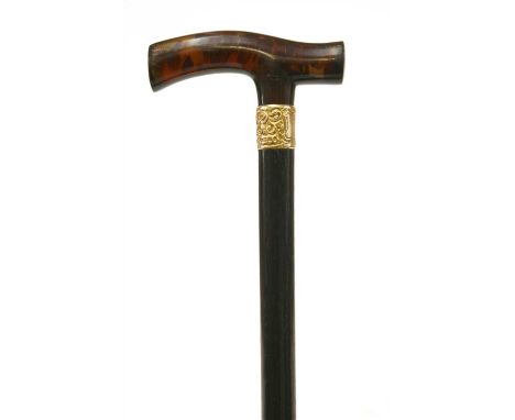 A tortoiseshell and ebonised walking stick , late 19th century, the 'T' shaped handle with 9ct gold repoussé decorated mount,