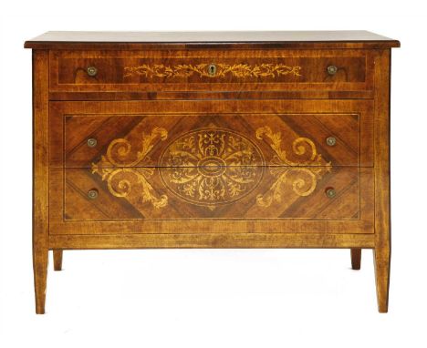 An Italian walnut and inlaid commode chest, 18th century style, having three graduated long drawers, and on square tapering l