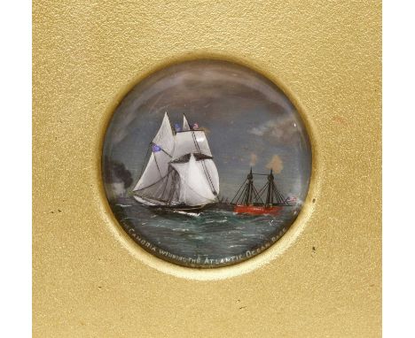 A reverse painted glass roundel depicting the schooner 'Cambria', 19th century, titled 'The Cambria Winning The Atlantic Ocea