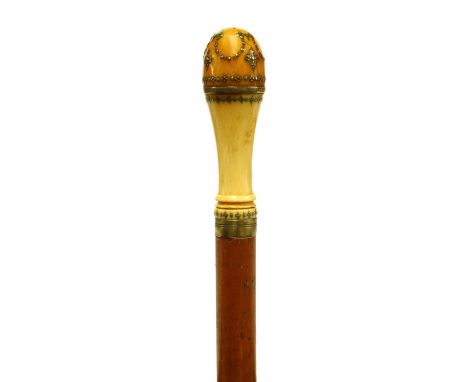 An ivory and malacca gadget walking stick , 18th century and later, the piqué work decorated handle unscrewing to reveal a co