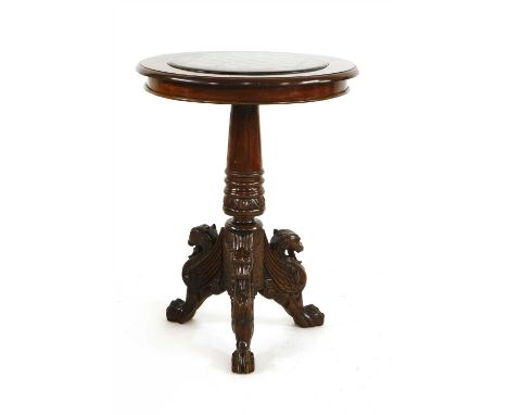 A carved walnut chess table, c.1860, the slate inset top painted with a simulated hardstone games board, raised on a step flu