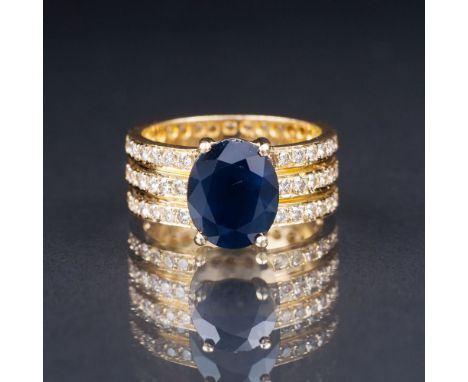 Saphir-Brillant-Bandring. 18 kt. GG, gest. Umlaufend drei-reihig besetzt mit 87 kl. Brill. zus. ca. 2,10 ct., Weiß(H)-Leicht 