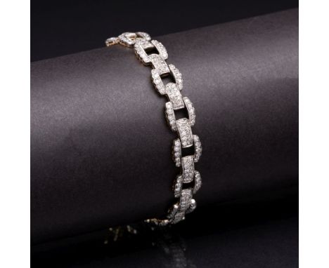 Art-déco Brillant-Armband. Um 1920/30. 18 kt. GG mit WG, gest. Bewegliche Armbandglieder, in Pavéfassungen reich besetzt mit 