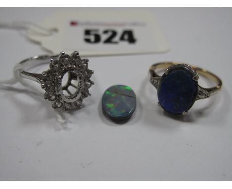 A Single Stone Ring, the oval doublet (damages) four claw set, stamped "9ct"; together with another loose doublet (damaged) a