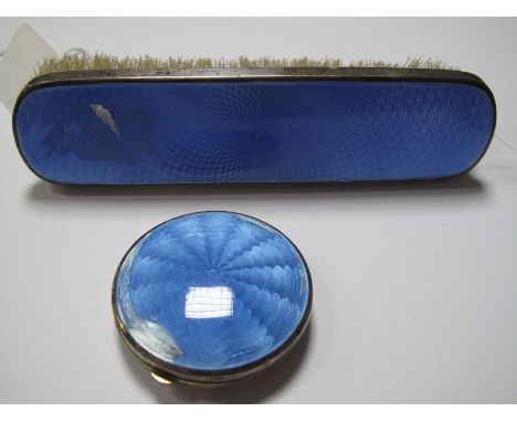 A Hallmarked Silver and Blue Enamel Compact, (lacking interior) (enamel losses); together with a similar brush. (2)