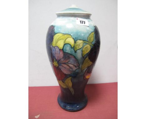 A Moorcroft Pottery Table Lamp, painted in the 'Anemone' pattern against a shaded blue ground, impressed marks and paper labe