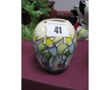 A Moorcroft Pottery Vase, painted in the Eight Maids a Milking design from the Twelve Days of Christmas series by Kerry Goodw