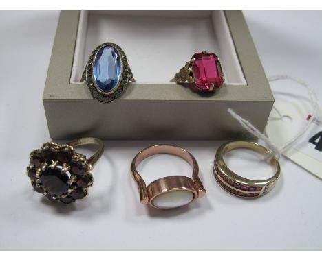 A Modern 9ct Gold Ruby Two Row Ring, a garnet cluster ring stamped "Silver"; a swivel design ring, etc.