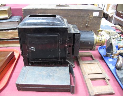 Magic Lantern Circa 1900, black lacquered with brass fitting and screw adjuster to lens, with box.