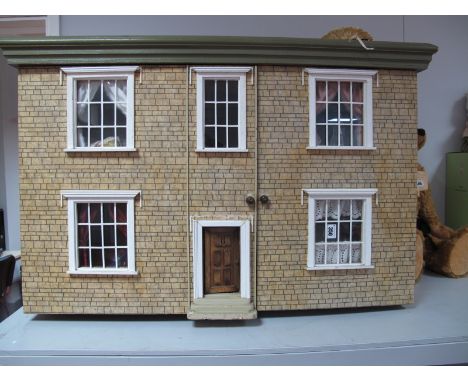 A XX Century Dolls House, two storey with sash windows, moulded cornice, with a large and full dressed interior and accessori
