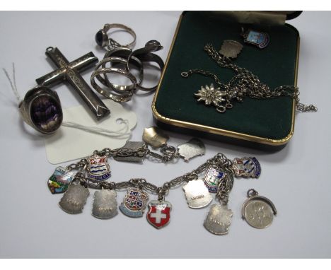 A Souvenir Enamel Shield Charm Bracelet, loose shields, decorative cross pendant, Blue John and other dress rings.