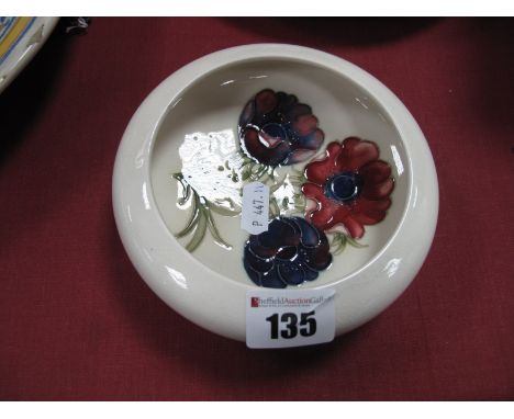A Moorcroft Pottery Circular Shallow Bowl, painted in the Anemone pattern against a cream ground, paper label "Potters to the