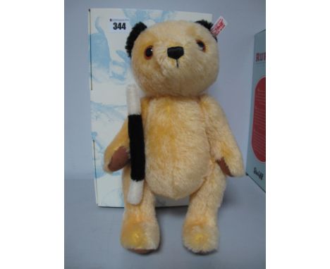 A Modern Steiff Jointed Sooty Bear, #663932, yellow, 30cm high, Certified No 97, boxed.