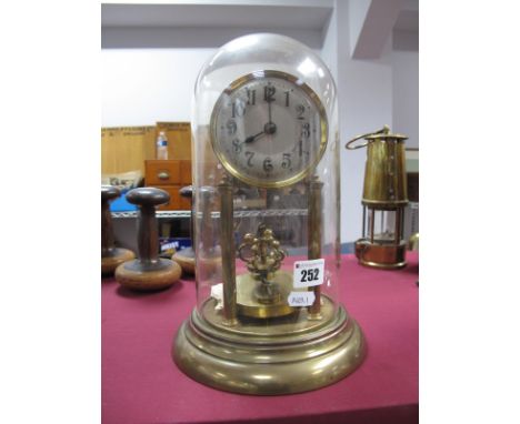 An Early XX Century German Gilded Brass Over Mantel Clock, with circular dial, supported by columns, stepped circular dial, u