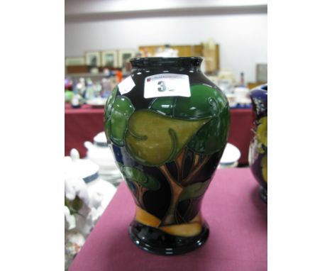 A Moorcroft Pottery Vase, of baluster form, painted with a 'Trial' design of sunrise behind stylised trees against a midnight