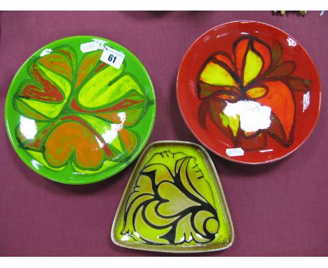 Poole Pottery - two circular No '3' dishes in The Aegean Manner, circa 1970's on green and red grounds, 20cm diameter. An '81