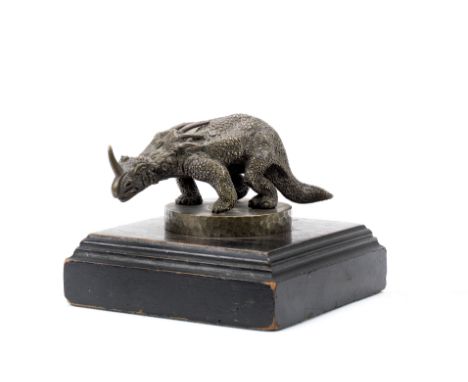 A rare 'Dinosaur' mascot, post 1913,bronze, 12cm long, mounted on a wooden display base. Footnotes:This dinosaur mascot is mo