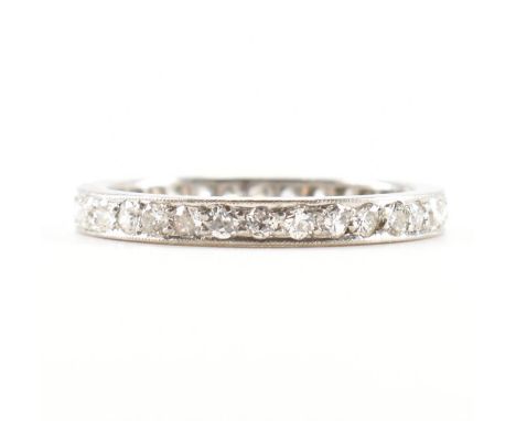 A French platinum and diamond eternity ring. The ring set with&nbsp; round brilliant cut diamonds to&nbsp; platinum mount. Es