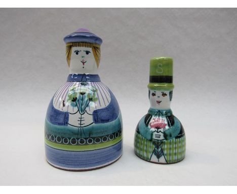 A pair of ceramic salt and pepper pots.  Hand-painted figurative forms.  Both signed to base, tallest 13cm