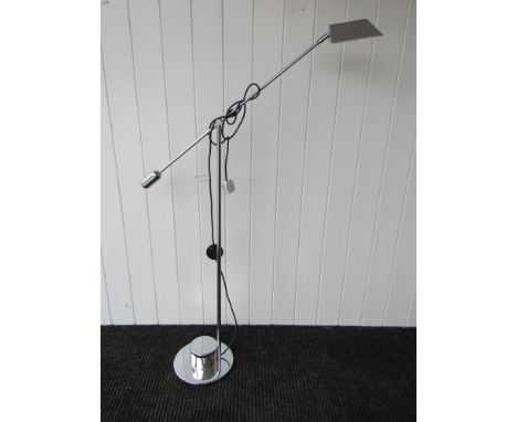A chrome plated adjustable floor-standing spot lamp