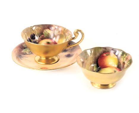 Three Royal Worcester fruit painted items, a sugar bowl decorated with apples and grapes, signed E Townsend, a cup decorated 