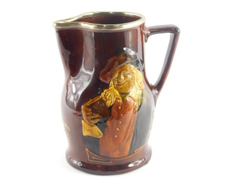 A Royal Doulton whisky jug, decorated with a figure with a book, and with raised slipware motto Thou Other's Purses Be More F