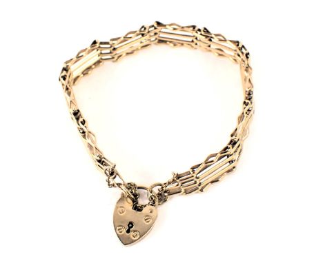A 9ct gold gate bracelet, of four bar design, with safety chain and heart shaped padlock, 18cm long, 15g. 