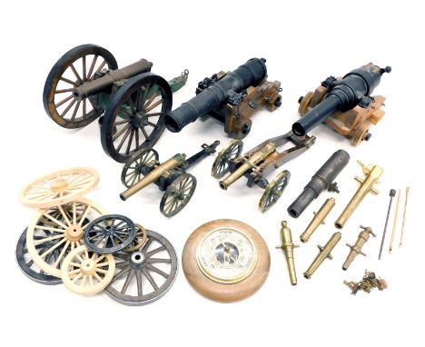 A collection of five model cannons, and various model cannon parts and components, including barrel and various wheels, etc. 