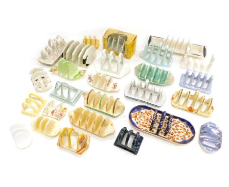 A quantity of novelty and other toast racks, to include Jersey Pottery, Carltonware, Bewley Pottery, etc. (2 trays) 