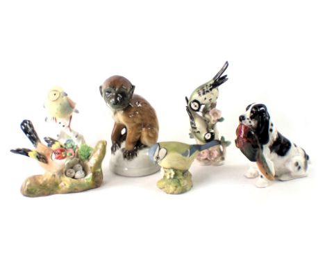 Various bird and animal ornaments, comprising a seated orangutan, Goebel and Beswick birds, Adderley bird group, and a Royal 