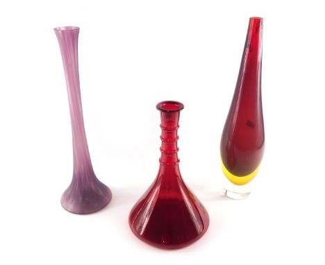 A large clear red and yellow slender Art Glass vase, 50cm high, a ship's decanter shaped ruby tinted glass vase, 33cm high, a