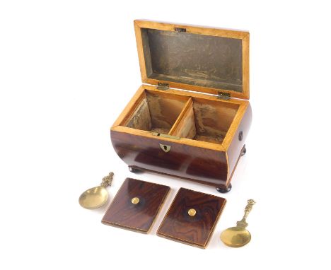 A Victorian rosewood and boxwood strung sarcophagus shaped tea caddy, the hinged lid enclosing two lidded compartments, on bu