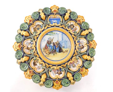 An early 20thC Porquier Beau Quimper cartouche platter, in raised and moulded high relief with green, yellow and royal blue d