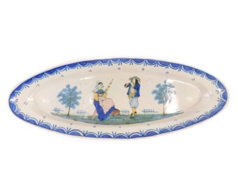 A large 19thC Quimper oval platter, decorated with a lady sewing and gentleman playing a musical instrument, HB stamp in blue