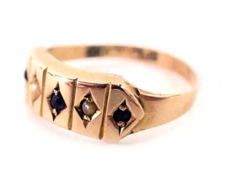A gypsy ring, set with seed pearl and sapphires, on a plain band, yellow metal stamped 9ct, ring size K½, 1.3g all in. 