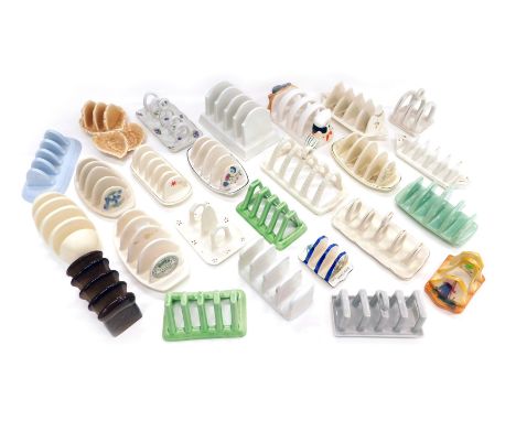 A collection of toast racks, various designs, to include Sylvac, Carltonware, novelty, etc. (2 trays) 