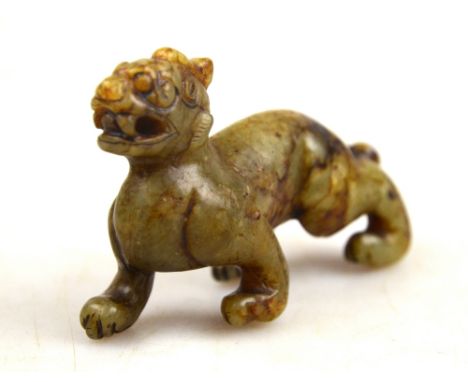 A Chinese nephrite jade carving a a fabulous animal, 7.5 cm long x 5.4 cm high 