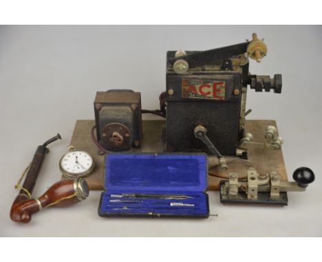 A Key W.T. 8 amp no.2 Morse Code tapper, to/w a German pipe, a cased compasses set, plated pocket watch and a Pathescope Ace 