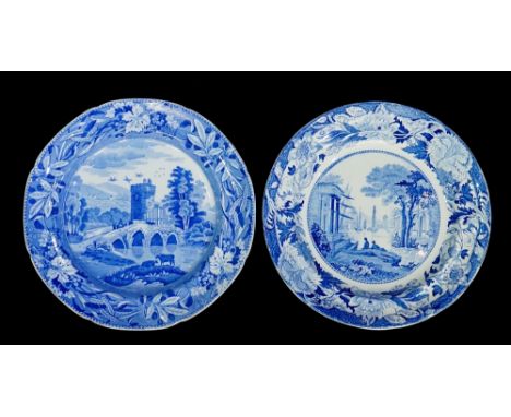 A Spode shaped circular plate transfer printed with figures on a bridge, castle beyond within berry leaf and corn border, 25c