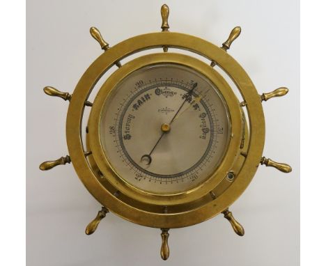 A late Victorian novelty ship's wheel barometer the silvered dial with Arabic numerals inscribed compensated, cylindrical dru