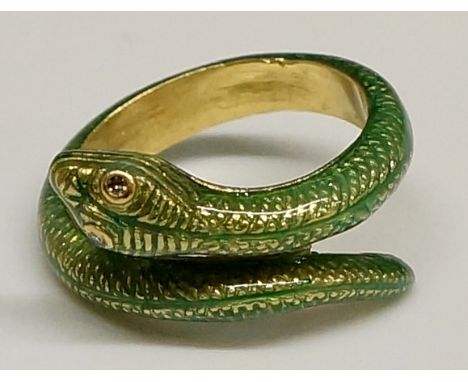 An 18ct yellow gold and green enamel serpent ring with gem set eyes, stamped .750 and numbered, ring size N